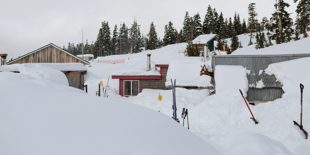 cabins on Mount Cain covered in snow