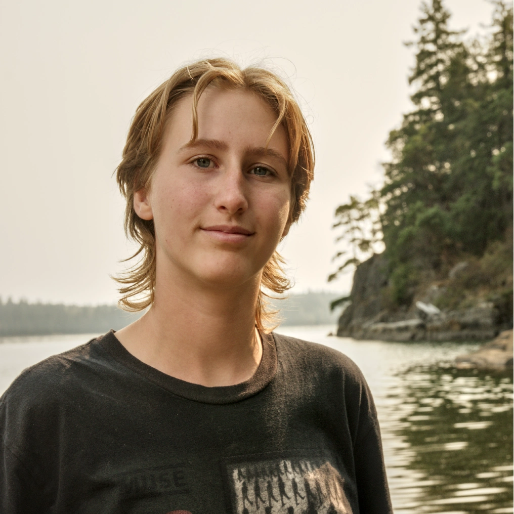 Cortes Island Academy student by the water on Cortes Island, British Columbia