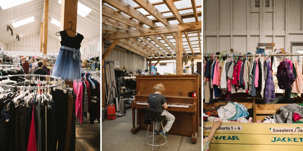 Interior of Hornby Island Free Store showing clothing, a community member playing piano, and organized racks