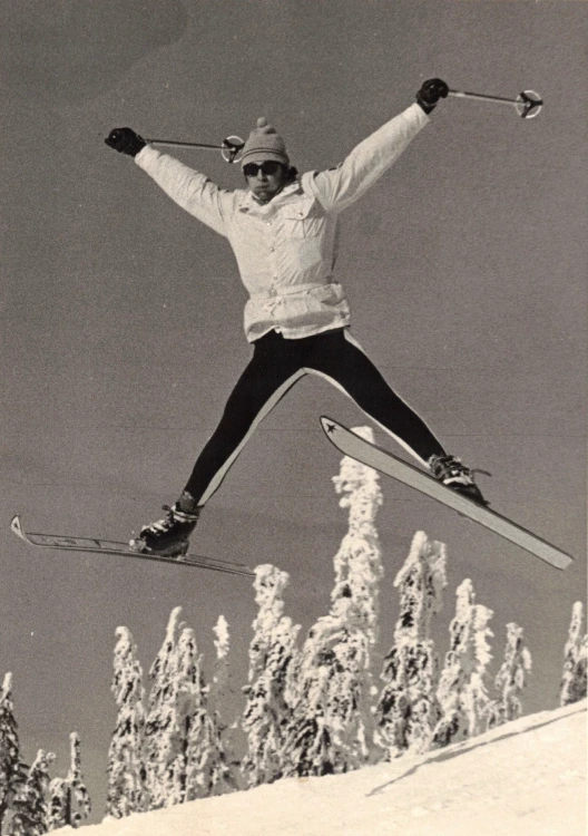 Peter Gibson does spread eagle on skis in the air, back in the day