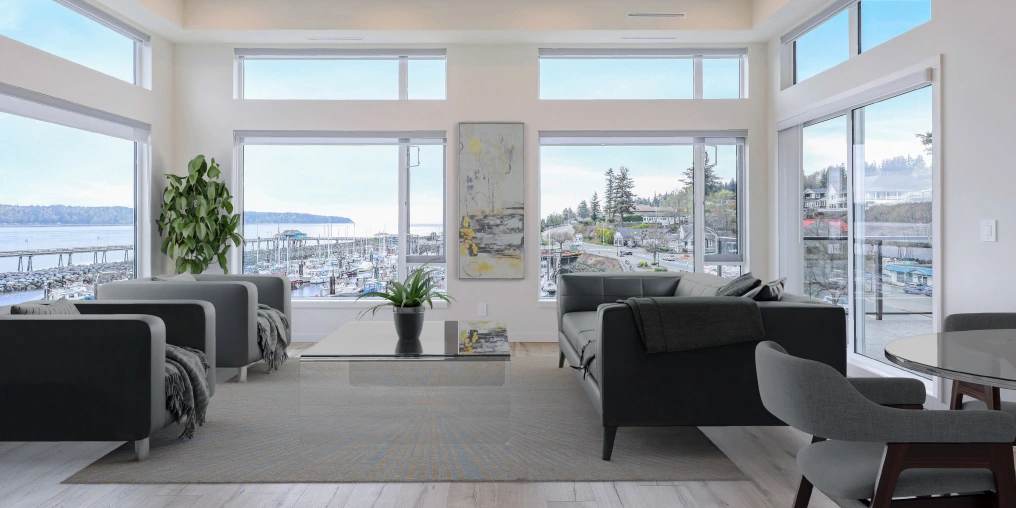 small space living room design with wraparound windows and Comox Valley marina view