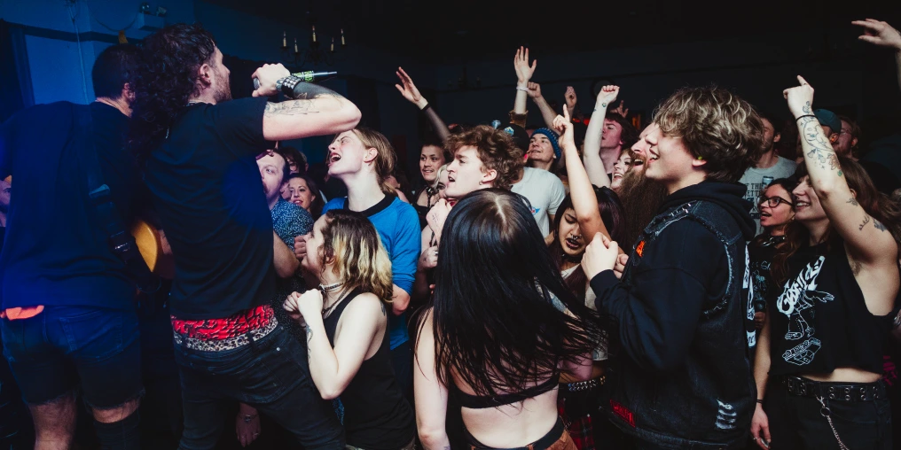 Energetic crowd at a Cumberland punk show at the Masonic Hall