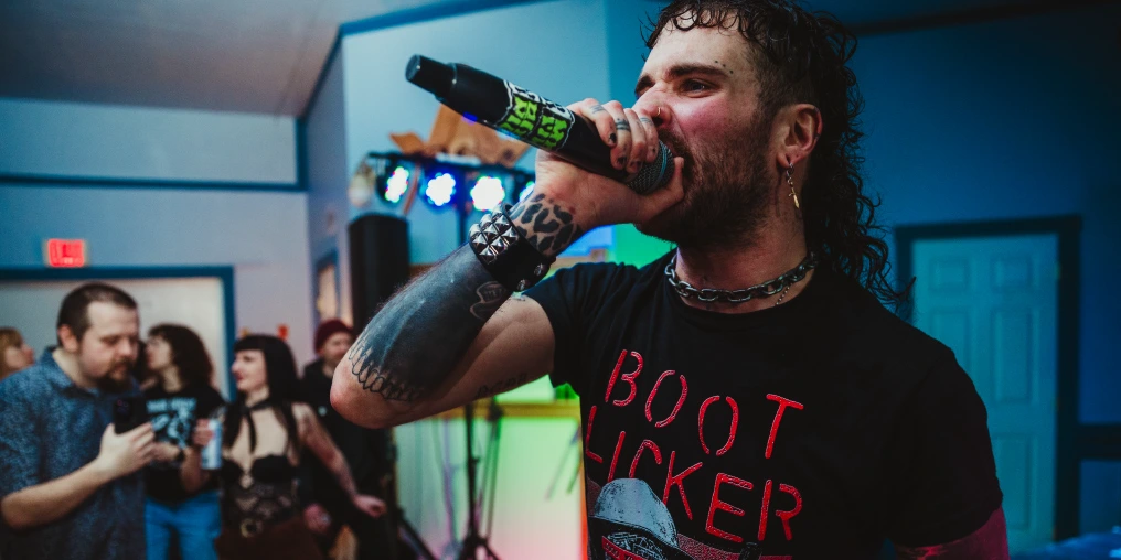 Mean Bikini vocalist performing at a punk show in Cumberland BC
