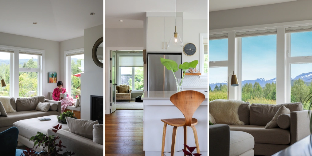 Interior of a custom Cumberland home showing open-concept living spaces with mountain views through large windows