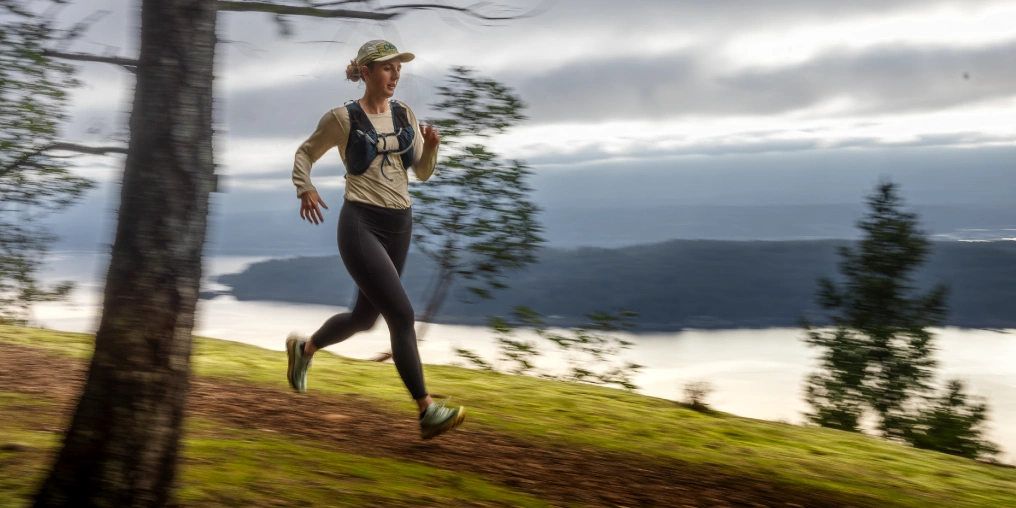 Runner racing along Hornby Island trails with the Strait of Georgia below, Hornby Island Trail Race