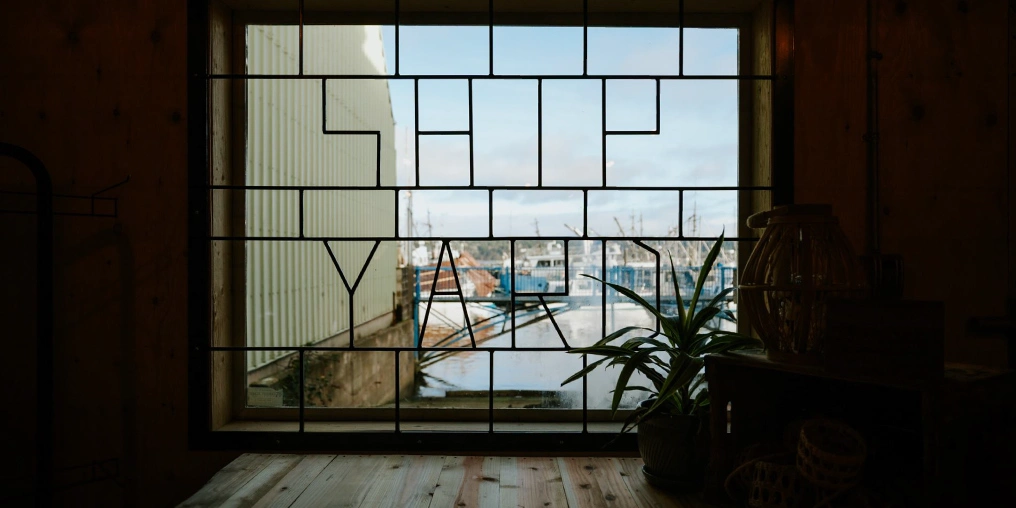 the word ship yard in a window