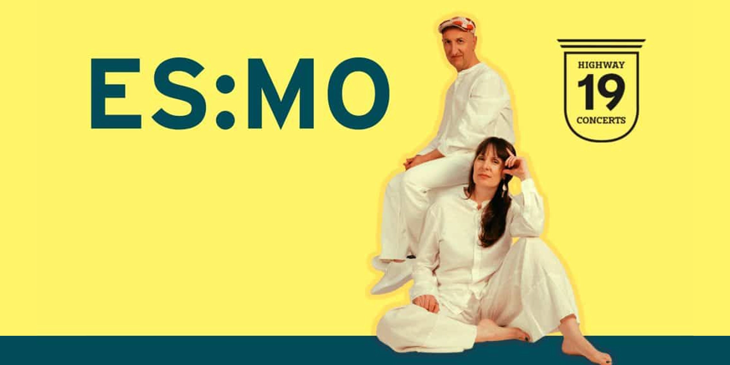 Elizabeth Shepherd and Michael Occhipinti sitting in front of a bright yellow background