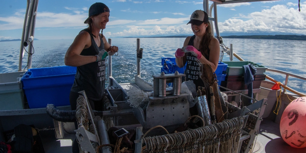 Kayla and Tiara tying fishooks on the Borealis