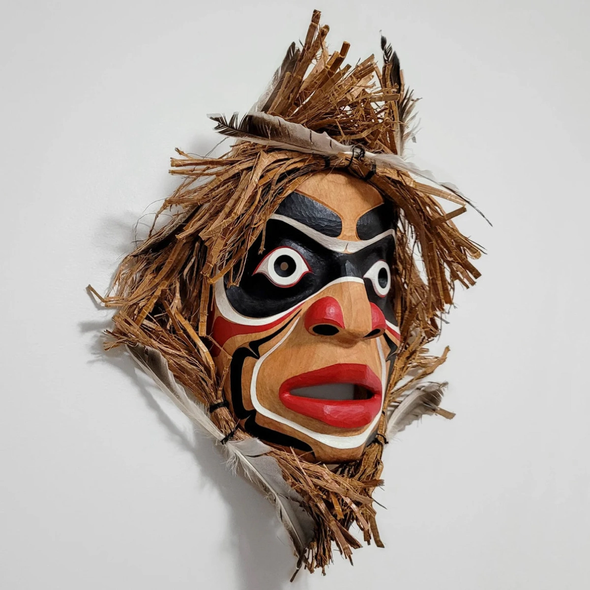 james-kwaksistala-medicine-man James Kwaksistala's Medicine Man mask made from alder wood, red cedar bark, feathers, lemon oil