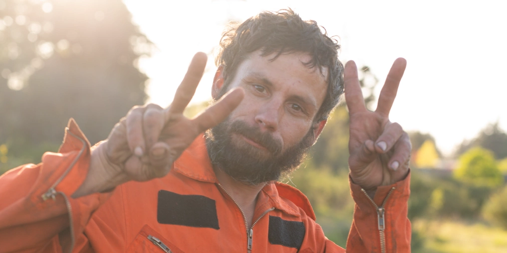 the gift of purpose Highway Jay flashes peace signs, reflecting the positivity he's known for around town
