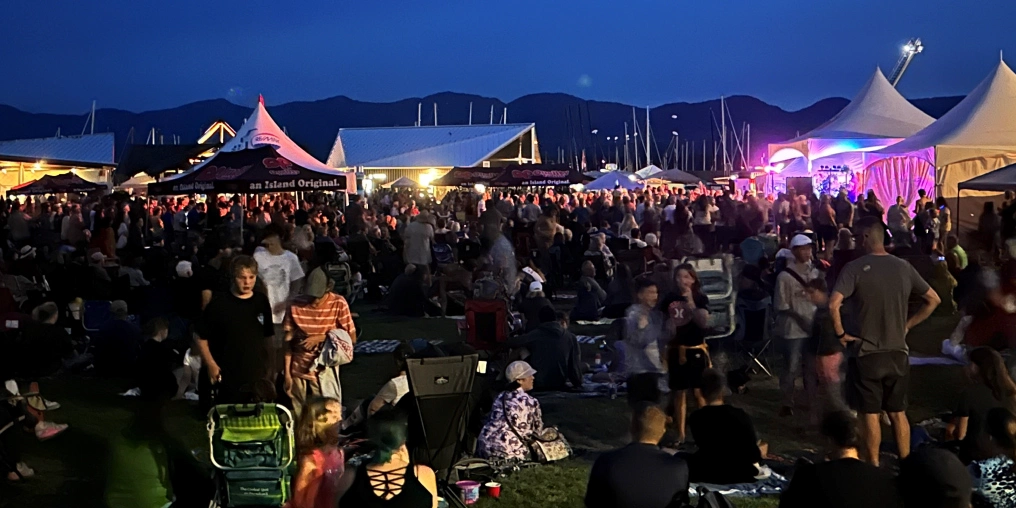Crowds gather for evening entertainment and festival food during Nautical Days