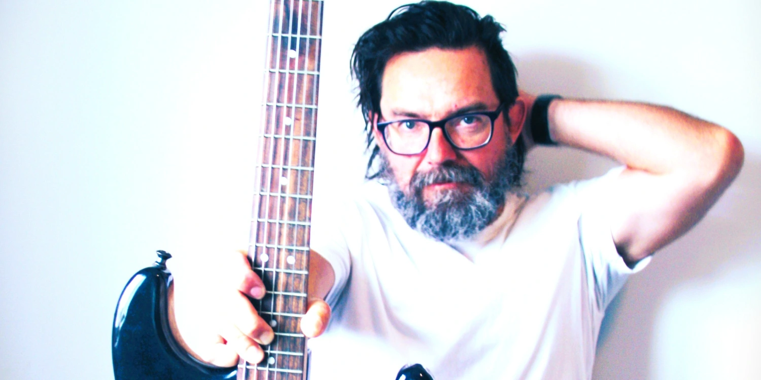ljp-comox-valley-musician L.J.P, Comox Valley musician, holding a bass guitar