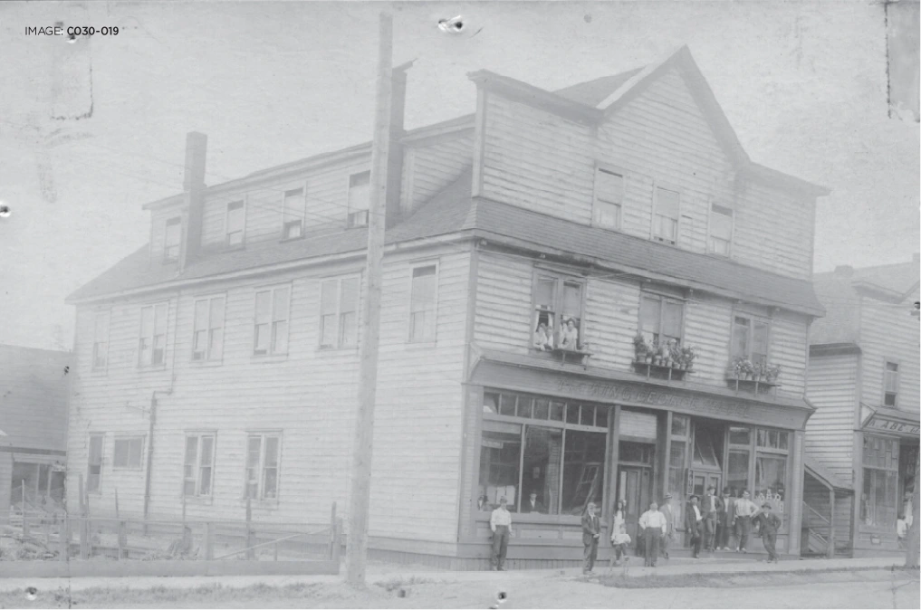 Through ups and down and many owners, Cumberland’s King George Hotel has been a community fixture Historic photo of the King George Hotel storefront in Comox Valley, with people gathered outside